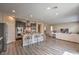 Open floorplan showing kitchen with barstool seating looking into living room at 10425 White Princess Ave, Las Vegas, NV 89166