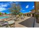 Outdoor patio with tables and chairs overlooking a pool area at 10425 White Princess Ave, Las Vegas, NV 89166