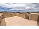 Spacious rooftop deck with stucco walls and panoramic views of the surrounding neighborhood at 10425 White Princess Ave, Las Vegas, NV 89166