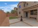 Backyard space offering a covered patio area, modern landscaping, and a fully fenced perimeter at 10728 Brewster Bay St, Las Vegas, NV 89179