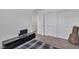 Bedroom with carpeted floors, an entertainment console, and a guitar at 10728 Brewster Bay St, Las Vegas, NV 89179