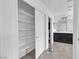 Walk-in closet and ensuite bathroom featuring ample storage space and modern fixtures at 10728 Brewster Bay St, Las Vegas, NV 89179