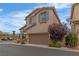 Charming two-story home with a large two car garage, covered entry and tasteful landscaping at 10728 Brewster Bay St, Las Vegas, NV 89179