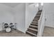 Hallway featuring stairwell with light wood treads and white risers at 10728 Brewster Bay St, Las Vegas, NV 89179