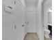 Hallway featuring two closets and a bathroom entrance at 10728 Brewster Bay St, Las Vegas, NV 89179