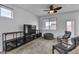 Relaxing living room featuring sleek furniture and lots of natural light at 10728 Brewster Bay St, Las Vegas, NV 89179