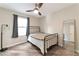 Cozy bedroom with a black metal bed frame and a large mirror at 10741 Pearl River Ave, Las Vegas, NV 89166