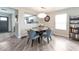 Inviting dining area with stylish table set, modern lighting, and sleek flooring at 10741 Pearl River Ave, Las Vegas, NV 89166