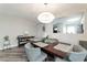 Dining room featuring sleek flooring, a stylish light fixture, and a view into the kitchen at 10741 Pearl River Ave, Las Vegas, NV 89166