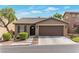 Charming single-story home with a well-maintained yard and a two-car garage at 10741 Pearl River Ave, Las Vegas, NV 89166