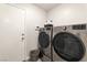Convenient laundry room with a modern washer and dryer set at 10741 Pearl River Ave, Las Vegas, NV 89166