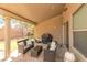 Covered patio with stone flooring, string lights, and outdoor seating area with grill at 10741 Pearl River Ave, Las Vegas, NV 89166