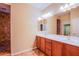 Bathroom features double sinks, a large mirror, and a tiled shower at 11242 Almador Vista Ct, Las Vegas, NV 89135