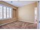 Bedroom with a window with white shutters and a view into the bathroom at 11242 Almador Vista Ct, Las Vegas, NV 89135