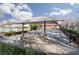 A shaded community area with seating by the pool at 11242 Almador Vista Ct, Las Vegas, NV 89135