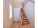 Entryway features tiled floors, stairs with wood railing, and a front door at 11242 Almador Vista Ct, Las Vegas, NV 89135