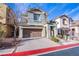 Beautifully landscaped front yard leading to a two-story home with a spacious driveway at 11242 Almador Vista Ct, Las Vegas, NV 89135