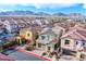 Two-story home with a beautifully landscaped yard, showcasing a blend of architectural design and natural beauty at 11242 Almador Vista Ct, Las Vegas, NV 89135