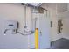 Garage showing hot water heater, solar electrical box, and electrical box at 11242 Almador Vista Ct, Las Vegas, NV 89135