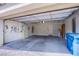 Spacious garage with ample storage space, a garage door and concrete floors at 11242 Almador Vista Ct, Las Vegas, NV 89135