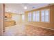 Bright living room with plantation shutters, neutral walls, and tile flooring at 11242 Almador Vista Ct, Las Vegas, NV 89135