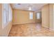 Bright living room with plantation shutters and neutral tile flooring throughout at 11242 Almador Vista Ct, Las Vegas, NV 89135