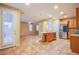 Open living space with a view of the stainless steel kitchen appliances and large door to patio at 11242 Almador Vista Ct, Las Vegas, NV 89135