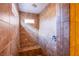 Walk-in shower featuring tan tile and a built-in bench at 11242 Almador Vista Ct, Las Vegas, NV 89135