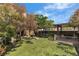 Beautiful backyard with artificial turf, a stone fountain, and covered patio area, perfect for outdoor entertaining at 1161 Sax Fifth Ave, Henderson, NV 89052