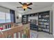 Bedroom with a crib, bookshelf, ceiling fan, window, and decor at 1161 Sax Fifth Ave, Henderson, NV 89052