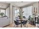 Bright breakfast nook with a round table, chairs, and natural light filtering through sheer curtains at 1161 Sax Fifth Ave, Henderson, NV 89052