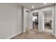 A landing area with access to an office, bedroom and a neutral color scheme at 1161 Sax Fifth Ave, Henderson, NV 89052