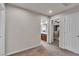 Hallway with views of the bathroom and a bedroom with a crib and bookshelf at 1161 Sax Fifth Ave, Henderson, NV 89052
