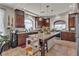 Beautiful kitchen boasts granite counters, a central island with seating, and stainless steel appliances at 1161 Sax Fifth Ave, Henderson, NV 89052