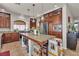 Spacious kitchen featuring stainless steel appliances, an island with granite countertop, and pendant lighting at 1161 Sax Fifth Ave, Henderson, NV 89052
