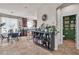 Bright and inviting kitchenette featuring modern appliances and decor, adjacent to a charming breakfast nook and powder room at 1161 Sax Fifth Ave, Henderson, NV 89052