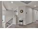 Second floor landing featuring a black metal banister, and access to rooms that offer ample space and natural lighting at 1161 Sax Fifth Ave, Henderson, NV 89052