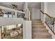 Bright living room with high ceilings, open floor plan, and a staircase to the upper level at 1161 Sax Fifth Ave, Henderson, NV 89052