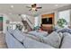 Inviting living area featuring a comfortable couch, entertainment center, and easy access to the staircase at 1161 Sax Fifth Ave, Henderson, NV 89052