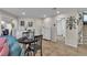 Bright living area features a dining table, white cabinets and decorated wall at 1161 Sax Fifth Ave, Henderson, NV 89052