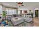 Spacious living room with comfortable seating, stylish decor, and abundant natural light at 1161 Sax Fifth Ave, Henderson, NV 89052