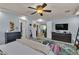Inviting bedroom with dual dressers, television, and stylish decor throughout at 1161 Sax Fifth Ave, Henderson, NV 89052