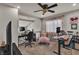 A functional office space featuring built-in shelving and a ceiling fan at 1161 Sax Fifth Ave, Henderson, NV 89052