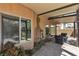 Charming covered patio with stone flooring and stucco walls, perfect for outdoor relaxation at 1161 Sax Fifth Ave, Henderson, NV 89052
