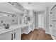 Bright bathroom boasts a large vanity with double sinks and modern fixtures at 1481 Rancho Ridge Dr, Henderson, NV 89012