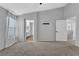 Large bedroom featuring neutral walls, plush carpeting and a glimpse into the ensuite bathroom at 1481 Rancho Ridge Dr, Henderson, NV 89012