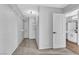 Walk-in closet with ample shelving and storage space, connecting to a modern bathroom at 1481 Rancho Ridge Dr, Henderson, NV 89012