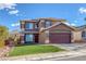 Charming two-story home with a well-manicured lawn and desert landscaping offering great curb appeal at 1481 Rancho Ridge Dr, Henderson, NV 89012