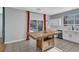 Bright kitchen with white cabinets, tile backsplash, and a wooden kitchen island at 1481 Rancho Ridge Dr, Henderson, NV 89012