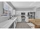 Modern kitchen featuring white cabinets, stainless steel appliances, and tile flooring at 1481 Rancho Ridge Dr, Henderson, NV 89012